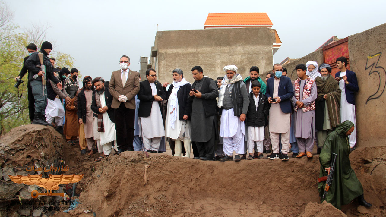 Efforts by Herat Local Authority officials to contain flood hazards in various areas of the city