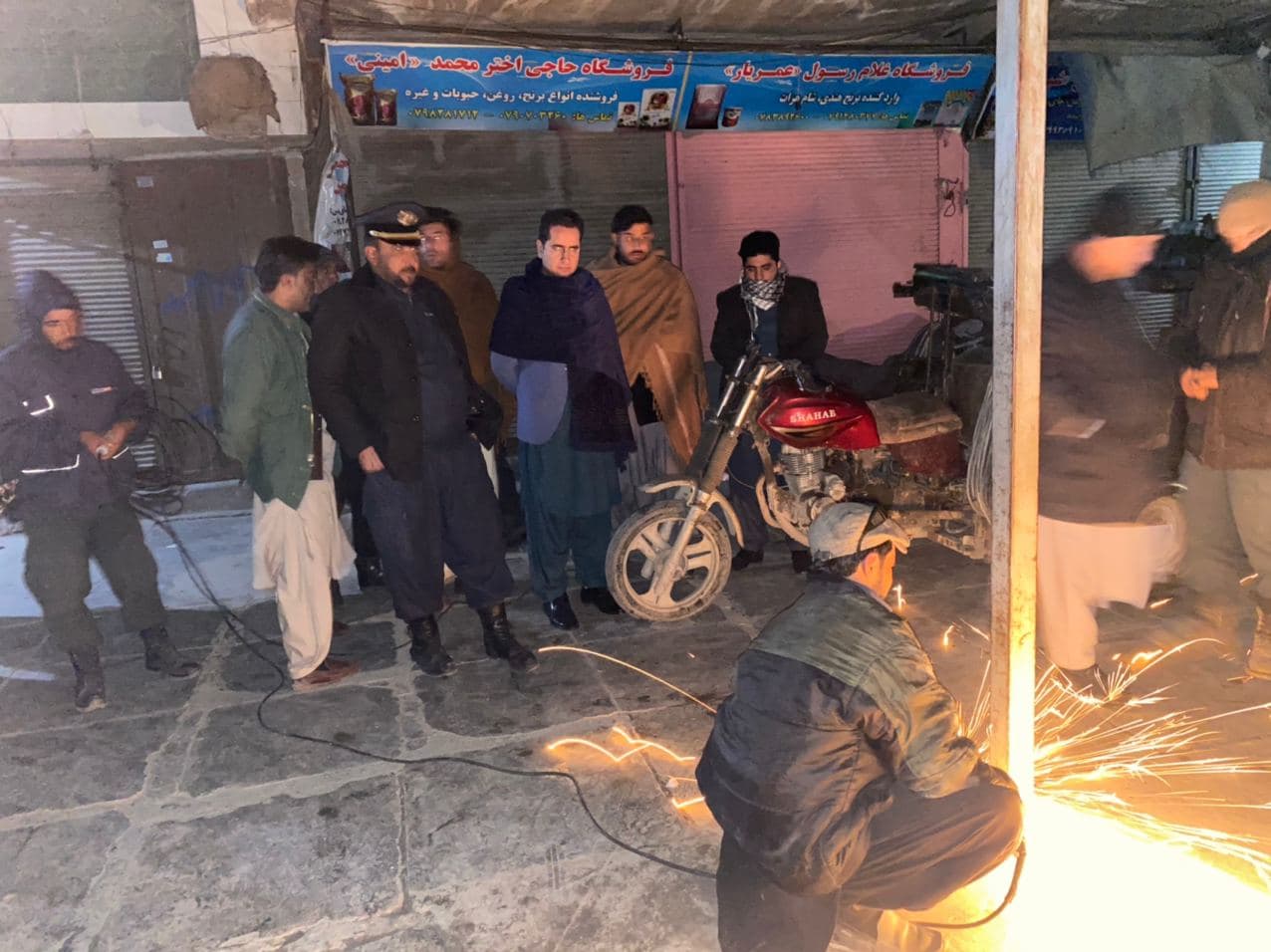 Gathering of canopies in front of the shops of Eidgah street guilds by night