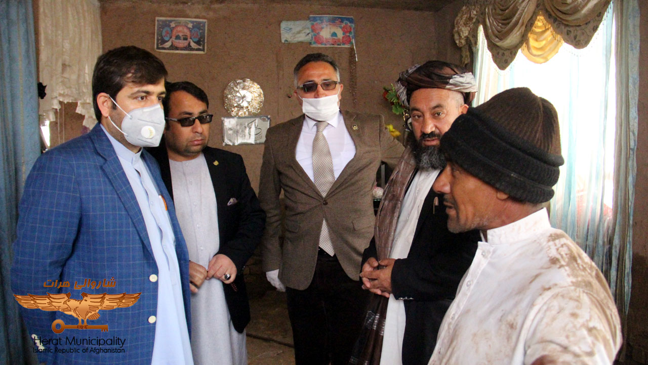 Efforts by Herat Local Authority officials to contain flood hazards in various areas of the city