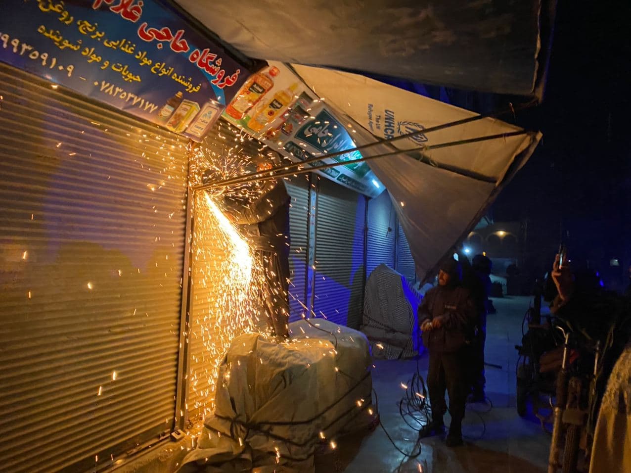 Gathering of canopies in front of the shops of Eidgah street guilds by night